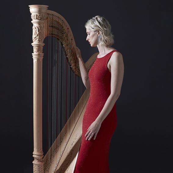 Photo of Georgia Lowe with a Harp