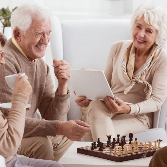 Mature male and female playing chess