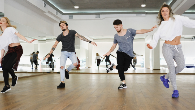 4 young people dancing