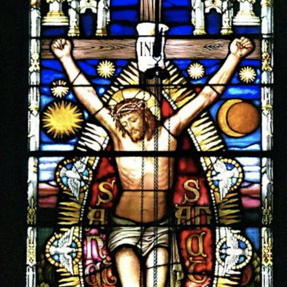 A stained glass window depicting the Crucifixion of Jesus