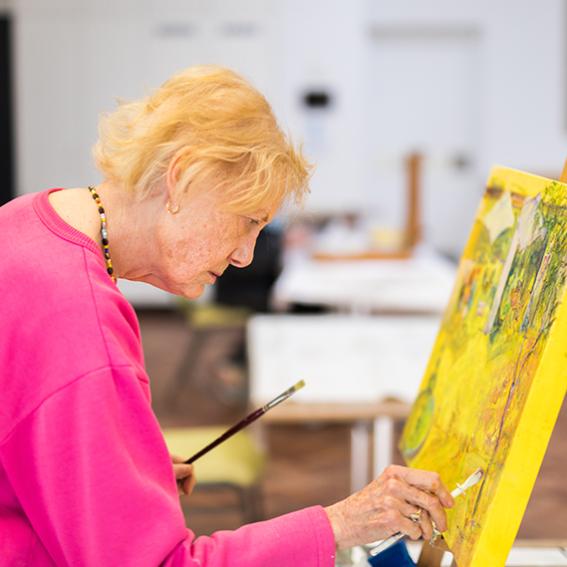 Mature lady painting