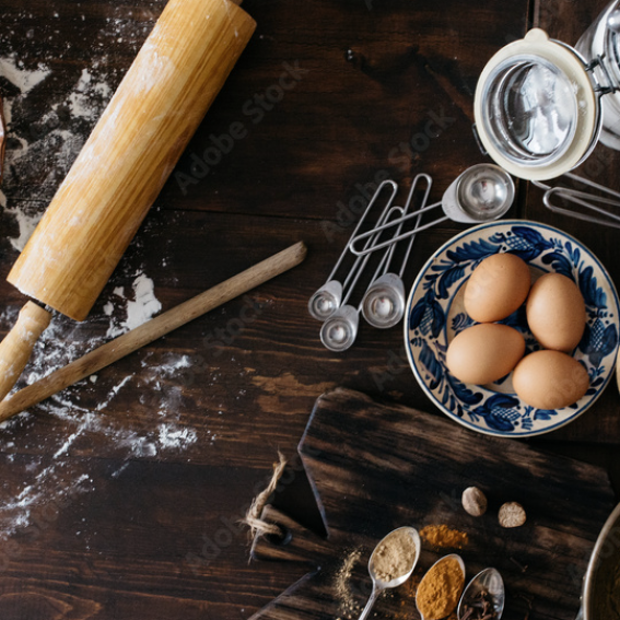 Baking materials spread out on counter, flour slightly spilled.