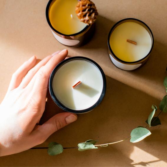 Three candles on a brown background.