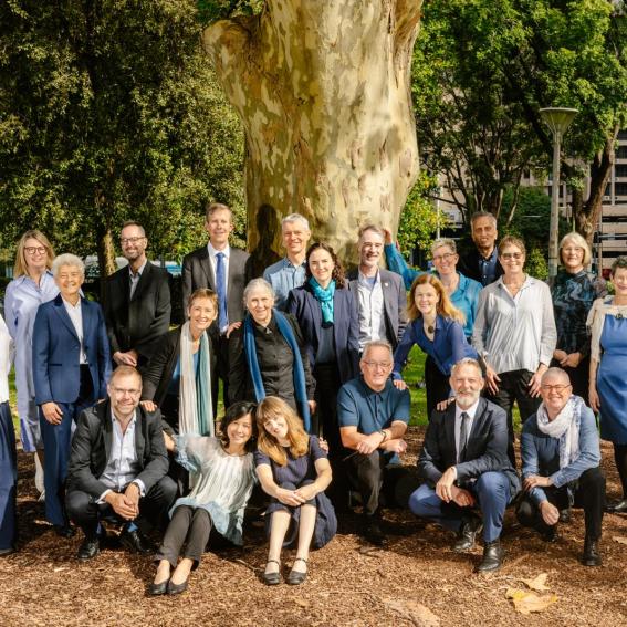Photo of choristers outside beneath a tree
