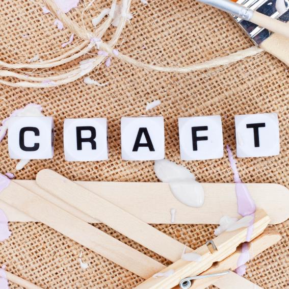 Hessian background with the word craft spelled out with white blocks.