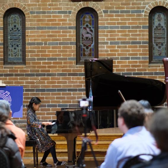 A young pianist performing in a Community Concert at the Mosman Art Gallery.