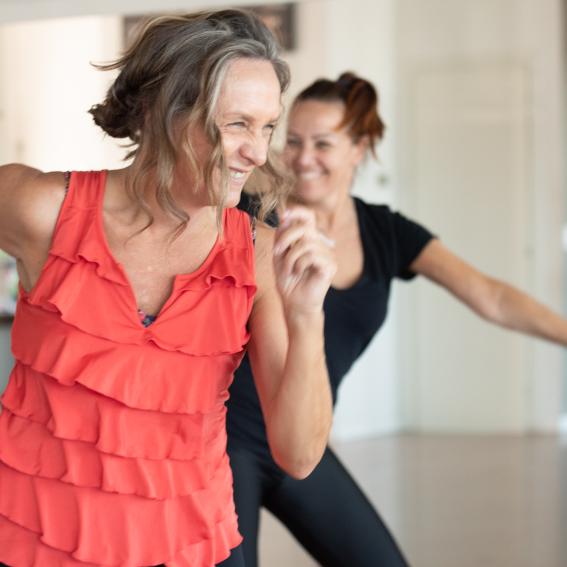 Woman enjoying a Nia mindful movement class