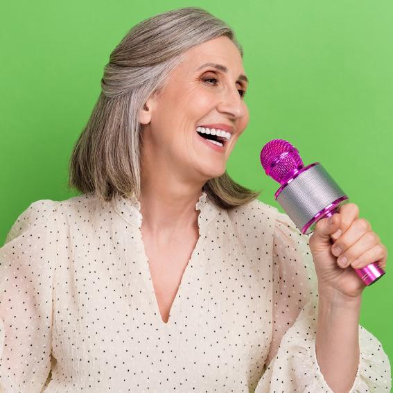 Lady singing into a microphone