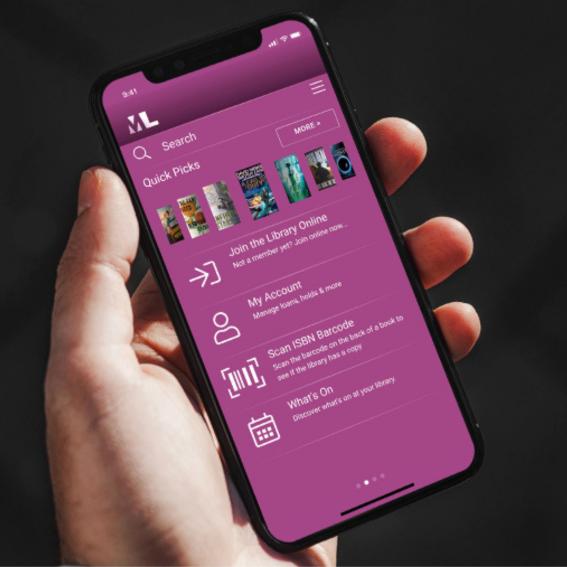 A person holding a phone with the MLS App.