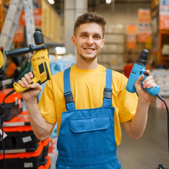 An image of a man holding tools