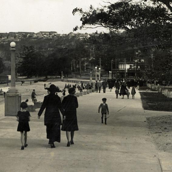 Black and white image of people walking the promenade, Balmoral back in the day.