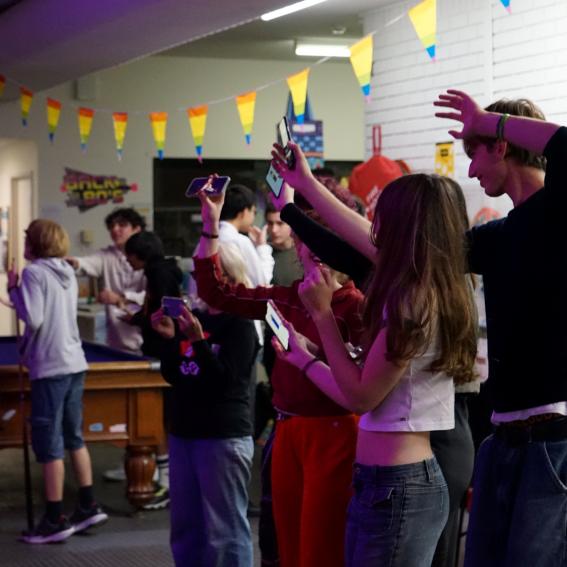 A group of young people dancing to live music