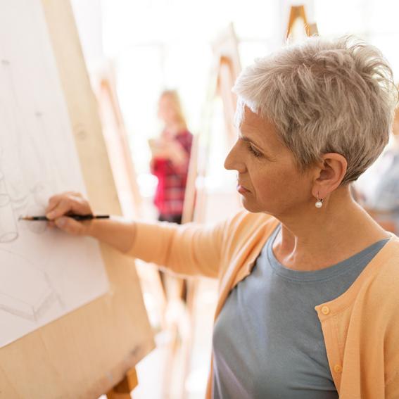 Image of a woman sketching a drawing