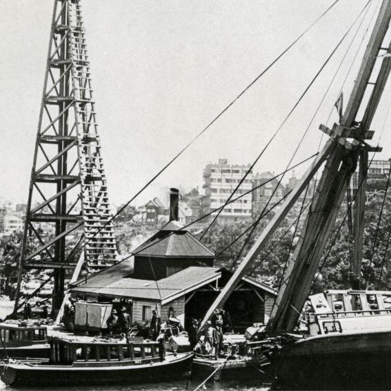 Black and white image of boats in Sydney Harbour.