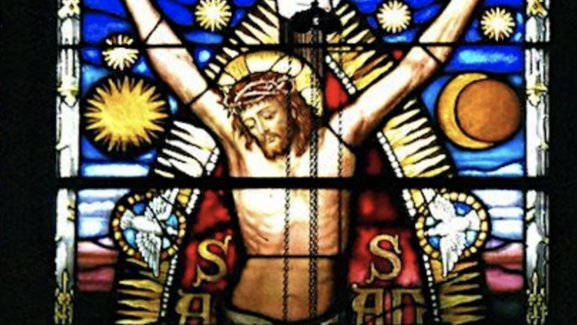 A stained glass window depicting the Crucifixion of Jesus