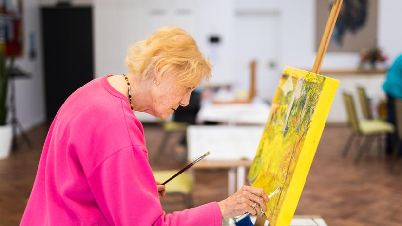 Mature lady painting