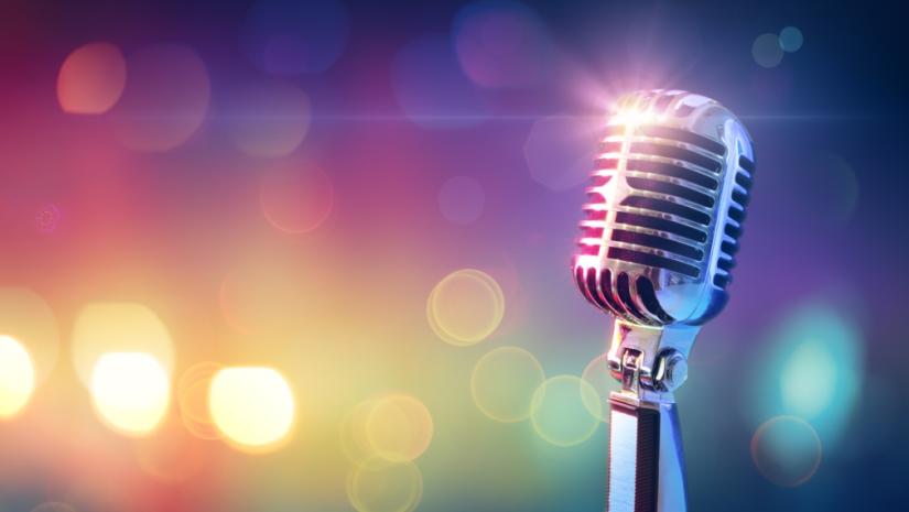 vintage microphone with a background of coloured lights
