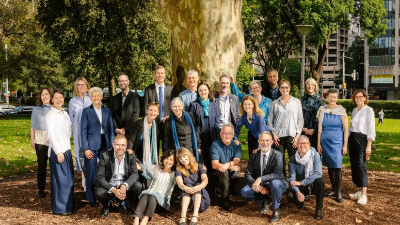 Photo of choristers outside beneath a tree