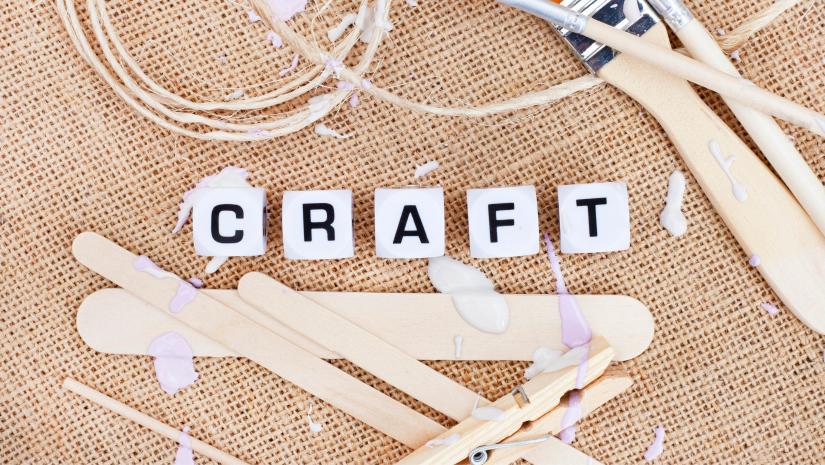 Hessian background with the word craft spelled out with white blocks.