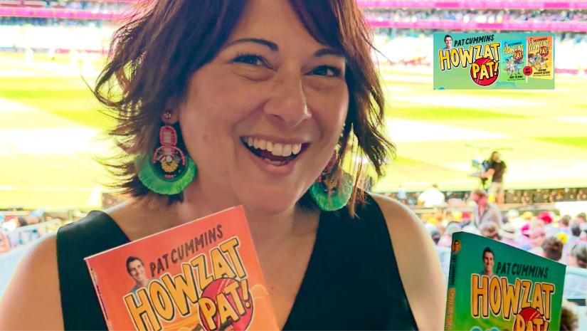 Serena Geddes holding two of her books.