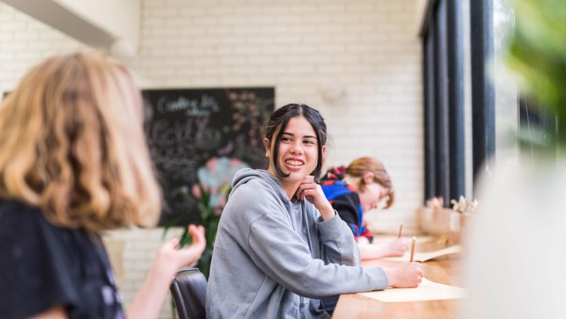 Curiosity Hub Young person sitting at a desk studying