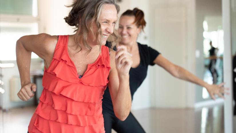 Woman enjoying a Nia mindful movement class