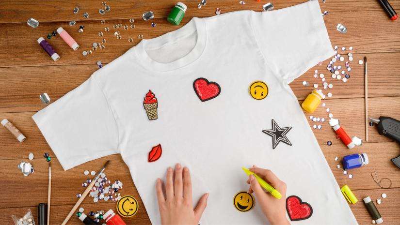 A white shirt with colourful decorations.