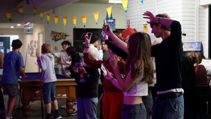 A group of young people dancing to live music