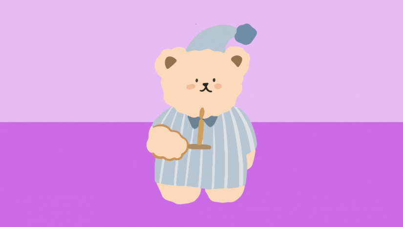 Cartoon bear in pyjamas holding a candle.