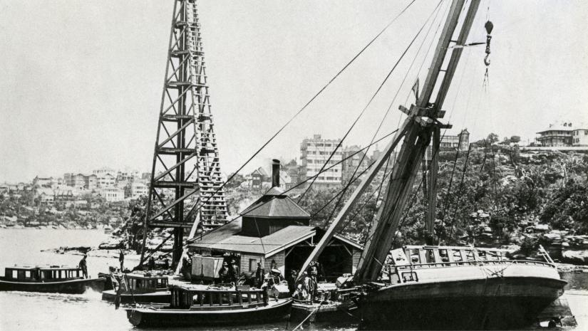 Black and white image of boats in Sydney Harbour.