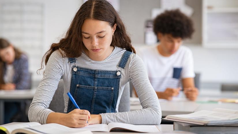Young woman writing.